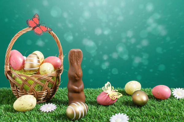 Basket Multicolored Easter Eggs Chocolate Rabbit Green Meadow Green Background — Stock Photo, Image