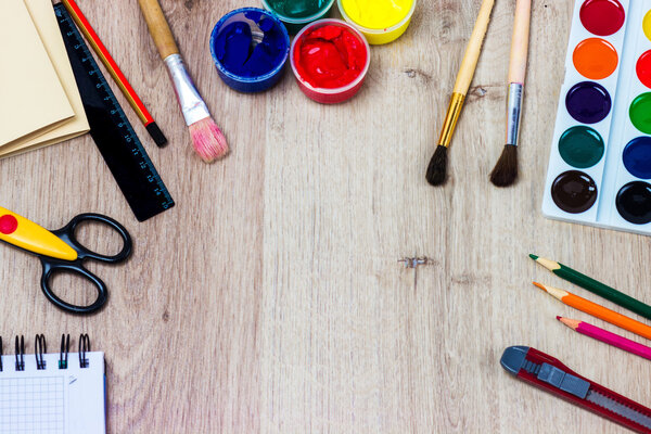 A set of stationery on wooden background, the place of the artist