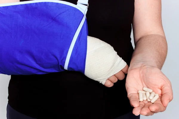 Young female with broken hand in cast — Stock Photo, Image
