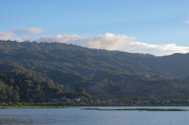 Scenic View of Lake and Mountains Under Sky