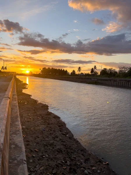 Scenic View of River and Cloudy Sky