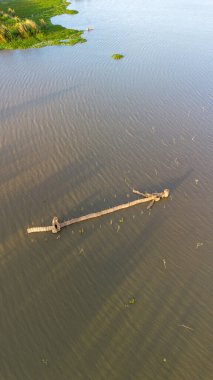 Aerial view of a bamboo fish trap in a lake