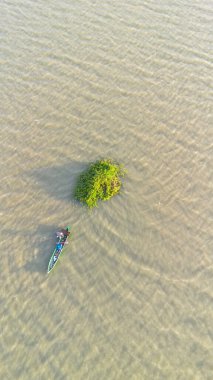 Aerial View of Fisherman in Boat on River