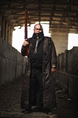 Portrait of a bald man from post-apocalyptic world with rifle in leather clothing as style Fallout or Mad Max clipart