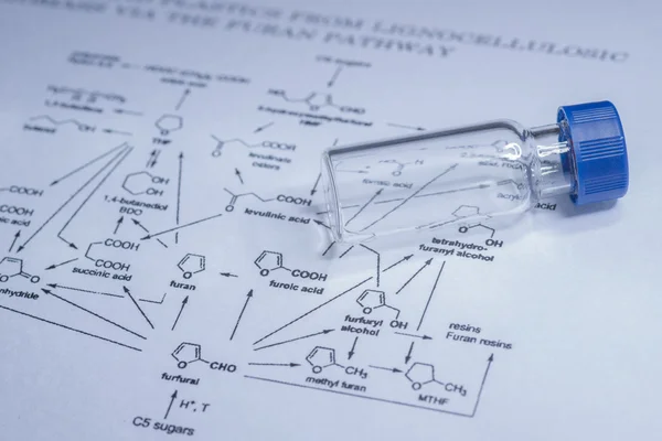 Vial de muestra en el papel —  Fotos de Stock