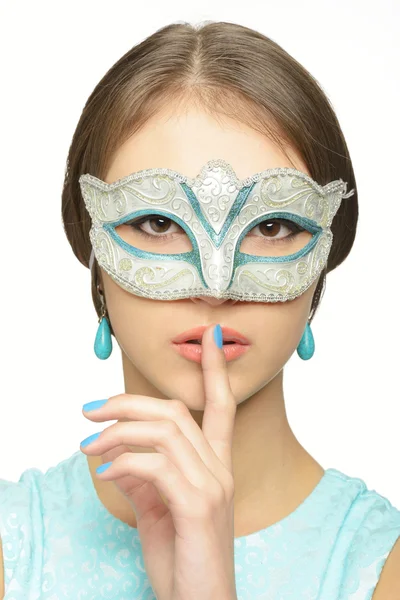 Young girl in a carnival mask