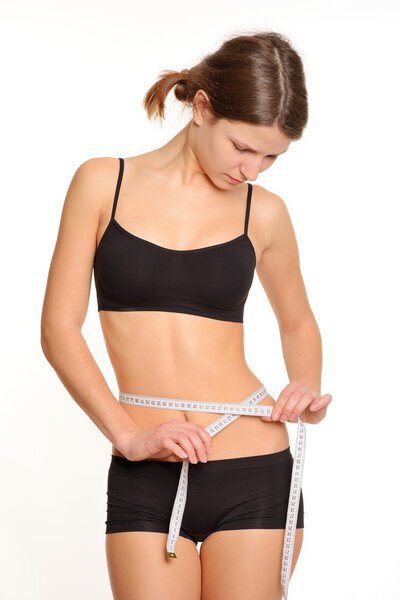Измерение идеальной фигуры молодой девушки
