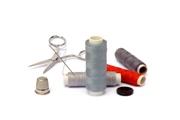 Needle, thimble, scissors, thread and knob — Stock Photo, Image