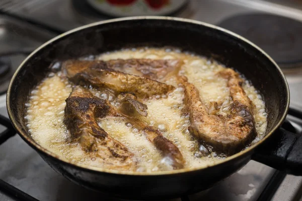Fish frying in a pan — Stock Photo, Image