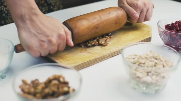 Woman rolling out walnuts — Stock Video