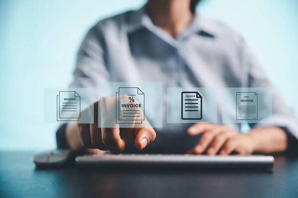 Businesswoman manages electronic statements, digital receipts on virtual screen, utilizing concept of e-invoice, digital billing, online invoice processing as smart e-tax and tax accounting solutions.