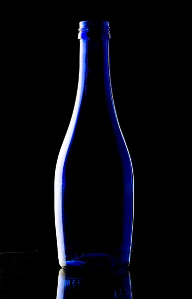 Blue bottle on black background — Stock Photo, Image