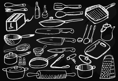 Siyah arka plan üzerine mutfak eşyaları.