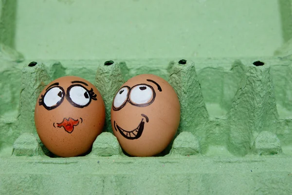 Two eggs face male and female lovers — Stock Photo, Image