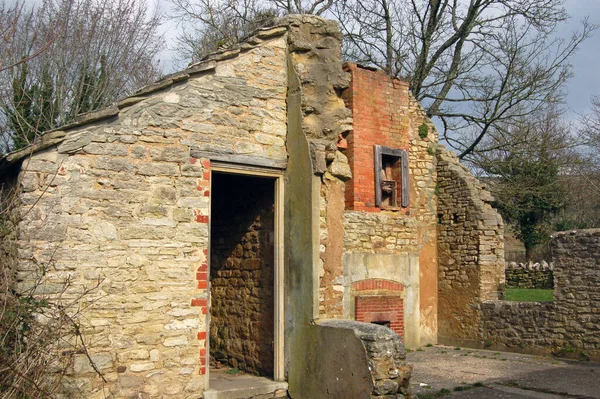 Remains of a cottage abandoned when the Ministry of Defence took over the village of Tyneham in Dorset to use as a firing range.