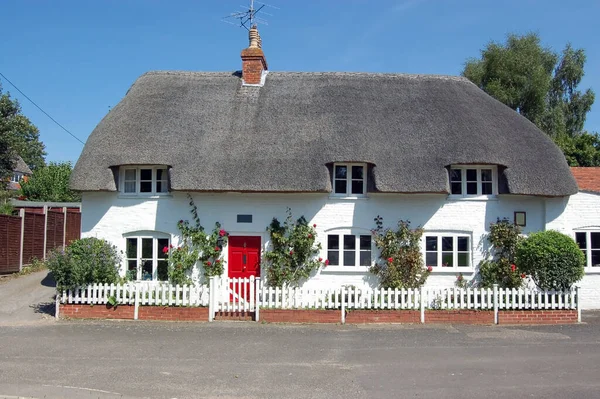 The thatched cottage which used to house the village post office in North Waltham, Hampshire.