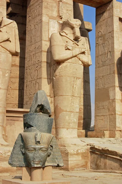 Statues of the great Ancient Egyptian Pharaoh Ramses II at the Ramasseum Temple on the West Bank of the Nile at Luxor, Egypt