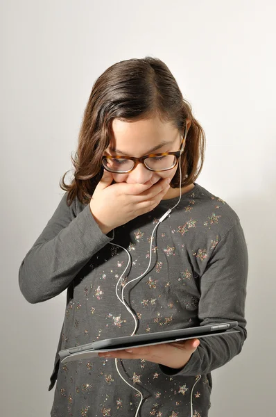 Young girl looking. Latin girl seeing internet. Young girl amazed. Young girl seeing forbidden things.