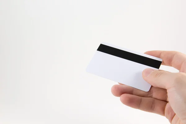 Mano con tarjeta de crédito sobre fondo blanco — Foto de Stock