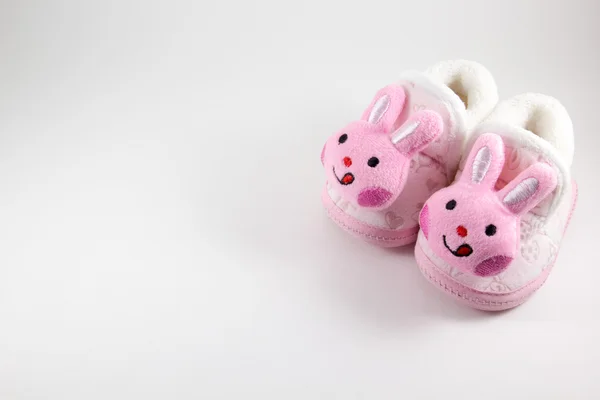 Baby booties på en vit bakgrund — Stockfoto