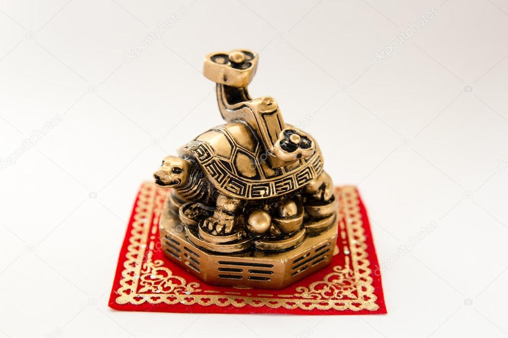 Symbol of a turtle figurine on a white background , Feng Shui