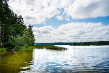 Calm lake reflecting clouds in Labanoro Regioninis Parkas