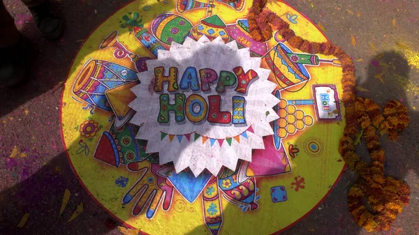 JAIPUR, INDIA - MARCH 21, 2019: a colorful happy holi sign painted on the ground for holi celebrations in jaipur — Stock Photo, Image