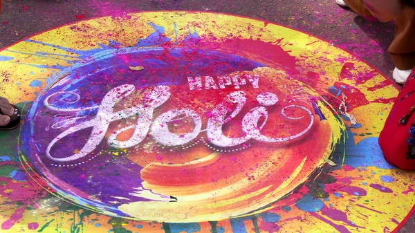 JAIPUR, INDIA - MARCH 21, 2019: close up of a colorful painted happy holi sign on the ground for holi celebrations in jaipur — Stock Photo, Image