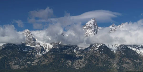 Close up of storm clouds clearing from teton mountain range at grand teton national park — Stock Photo, Image