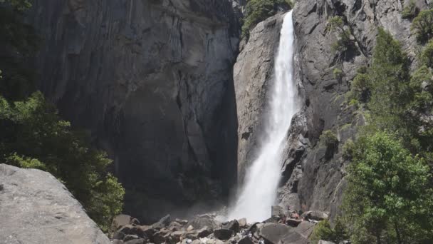 A slow motion wide angle clip of lower yosemite falls in yosemite national park — Stock Video