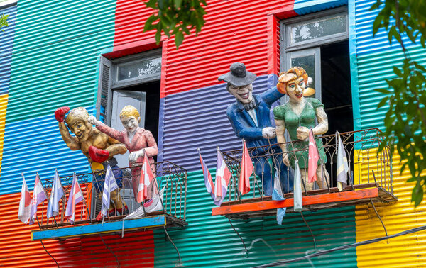 BUENOS AIRES, ARGENTINA- MARCH, 10, 2024: figures of four famous argentinians on a balcony in la boca district