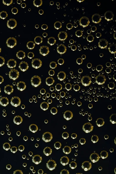 Goldene Luftblasen Auf Einer Ebenen Oberfläche — Stockfoto