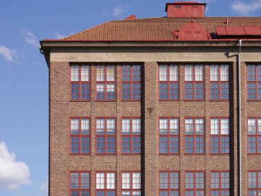 A tall brick building against sky
