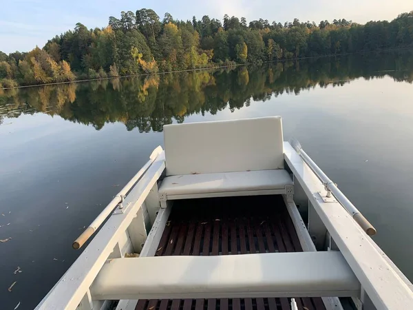 Fishermans boats at autumn on a lake