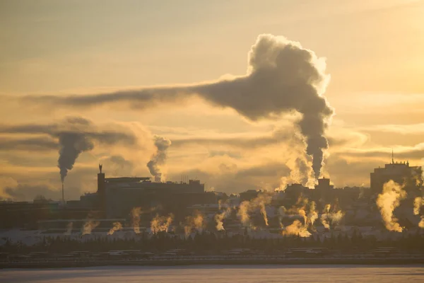 Polluted city concept. Smoke of factories cover the city