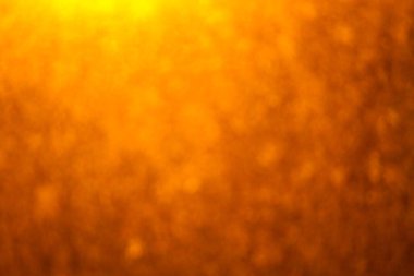 Soyut turuncu ve sarı arkaplan. Arkaplanda güneş ışığı