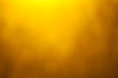 Soyut turuncu ve sarı arkaplan. Arkaplanda güneş ışığı