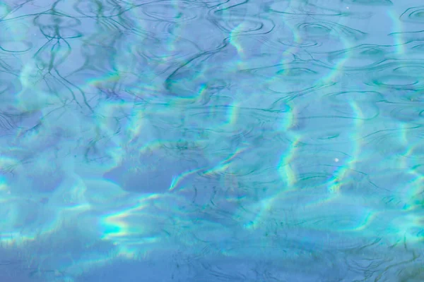 Blauer Wasserhintergrund Mit Reflexionen Der Sonne — Stockfoto