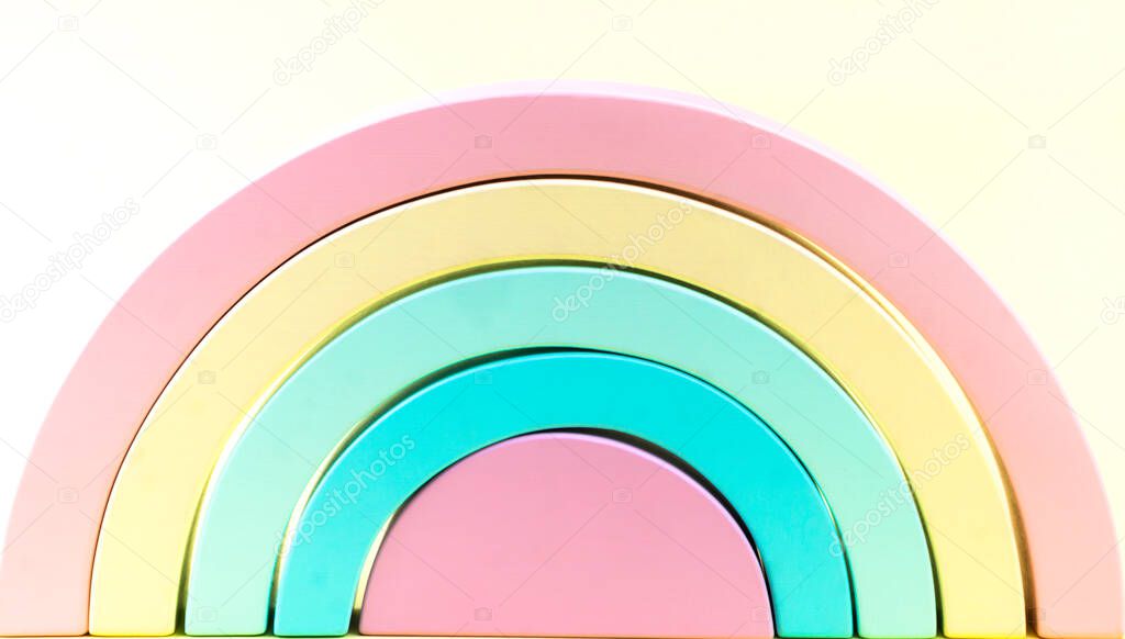 wooden rainbow of pastel colors, creativity puzzle in the form of a rainbow, toy for a chil