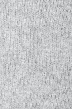 2021 'in modaya uygun renginde örülmüş rahat kumaş dokusu, duvar kağıdı veya soyut arkaplan için nihai gri. El yapımı örgü..