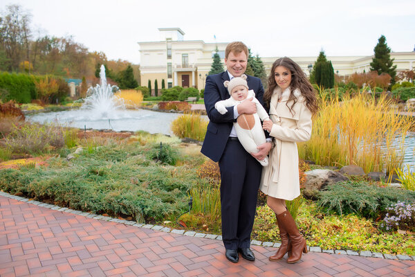 Beautiful Young Family Portrait outdoors in autumn
