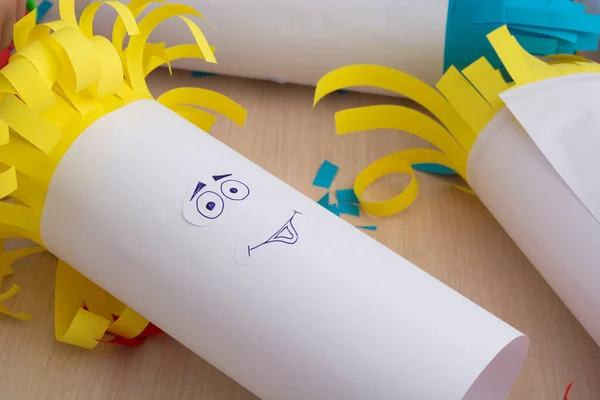 Creativity paper handmade for children. Funny faces on tubes with colorful hair