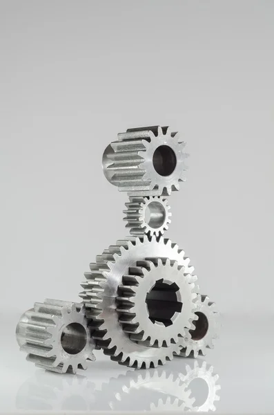 Set of gears on grey background — Stockfoto