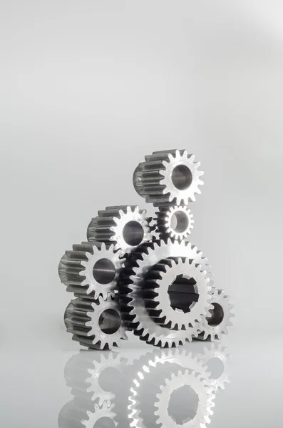 Set of gears on grey background — Stockfoto