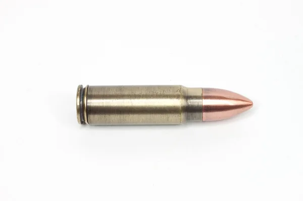 The bullet on the white — Stock Photo, Image