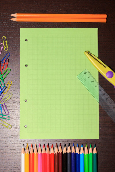 School supplies on dark background. Back to school concept