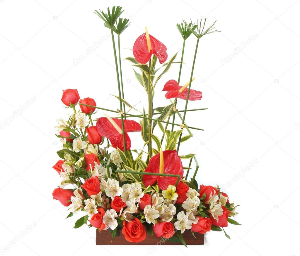 Floral arrangement with roses in wooden pot over white background