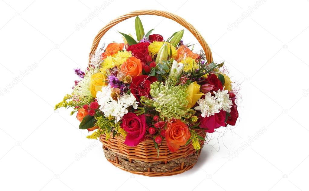 Basket with colorful flowers on white background