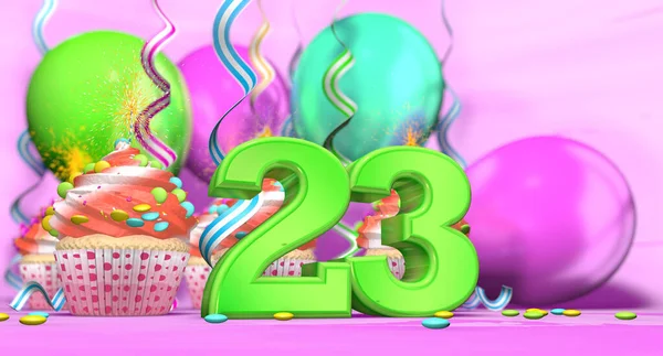 Birthday cupcake with sparking candle with the number 23 large in green with cupcakes with red cream decorated with chocolate chips and balloons on the back on a pink background. 3D illustration