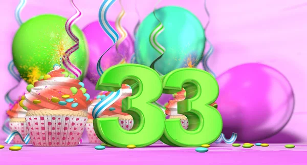 ピンクの背景にチョコレートチップと風船で飾られた赤いクリームとカップケーキと緑の33大の数で輝くキャンドルを持つ誕生日カップケーキ 3Dイラスト — ストック写真